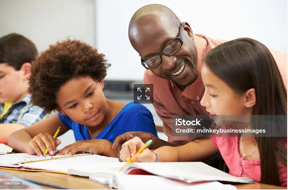 Teacher helping students